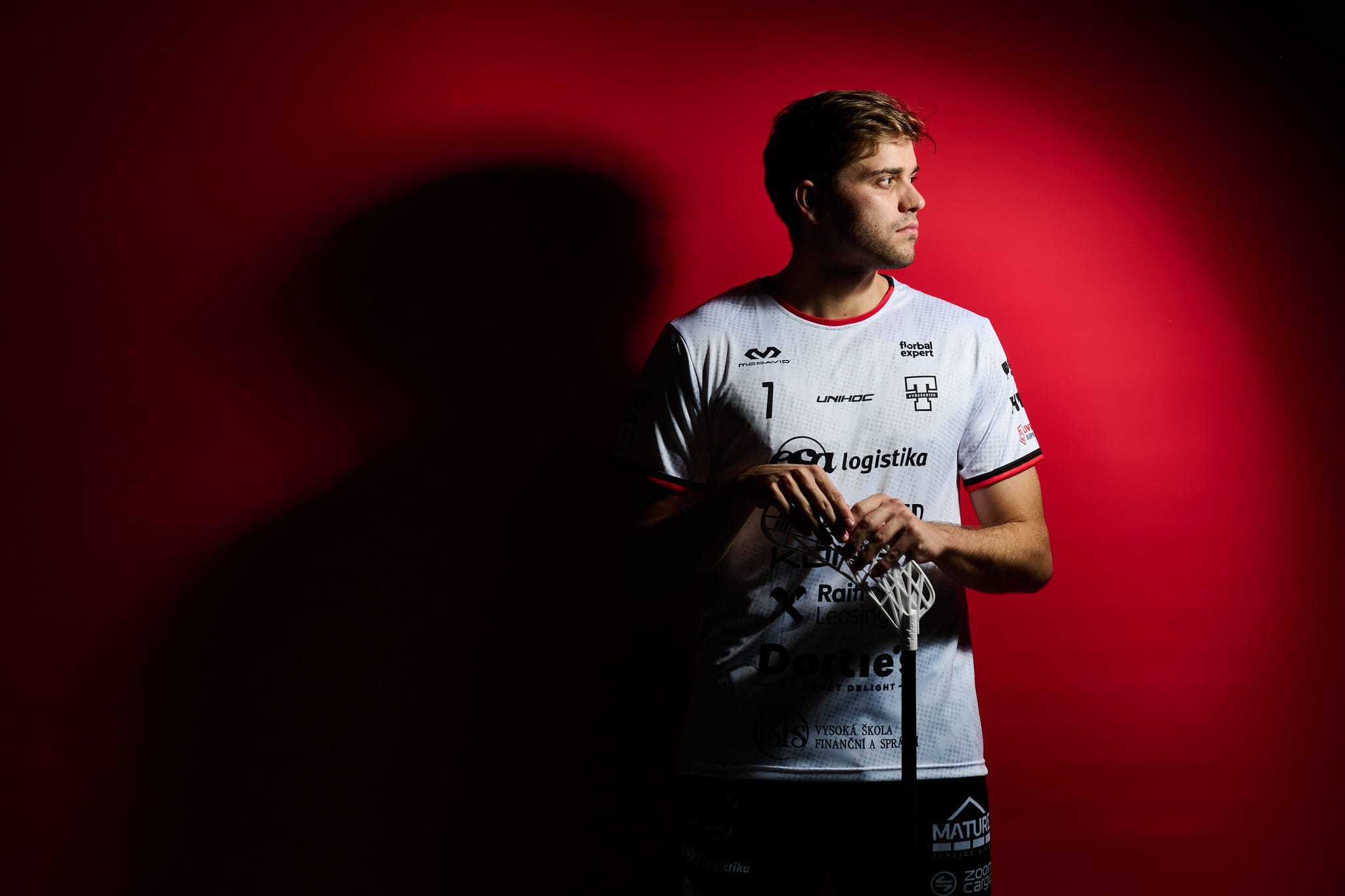 Tatran Střešovice player in front of a red backdrop